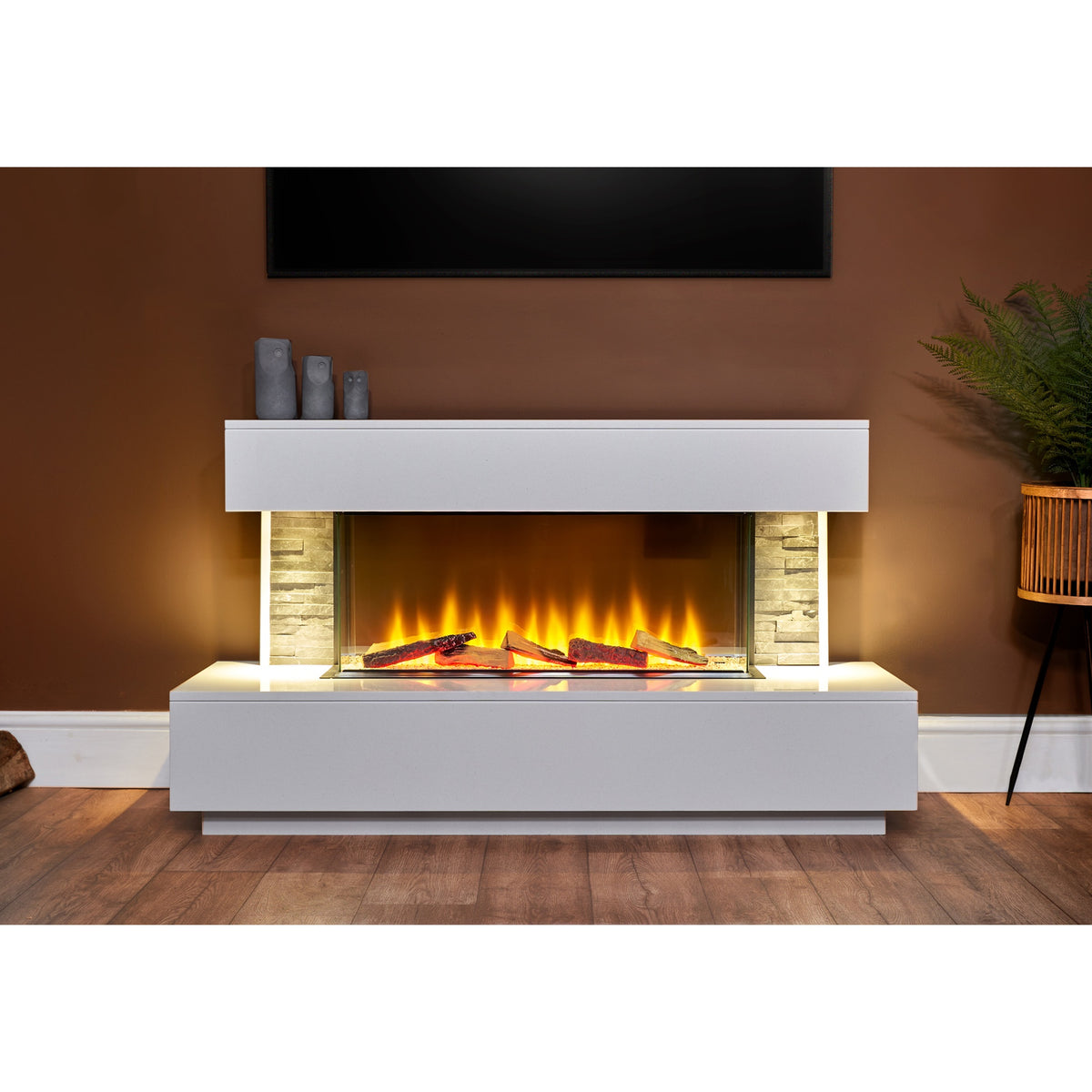 Acantha Aspen 50 inch electric fireplace suite with downlights on in a living room