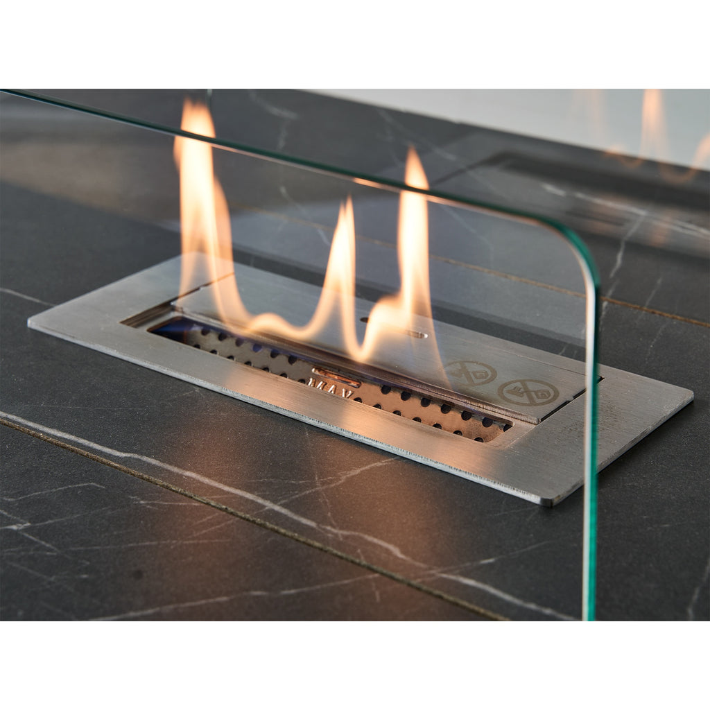 Close-up of the stainless steel burner and glass guards on the Acantha Castellon coffee table