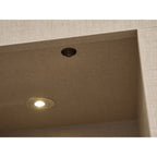 Close up of the downlight and switch in the Acantha chamber kit in linen