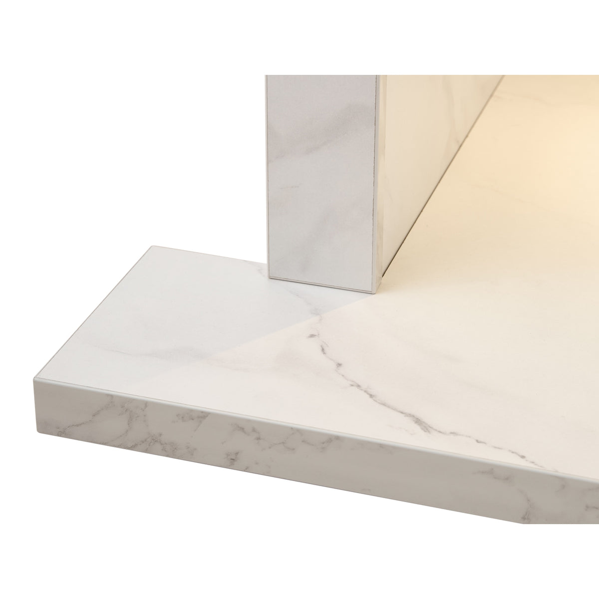 Close up of the hearth corner of the Acantha chamber kit in white marble effect