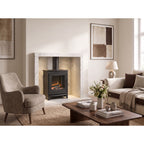 Acantha chamber kit in white marble effect with a stove in a living room, stove not included