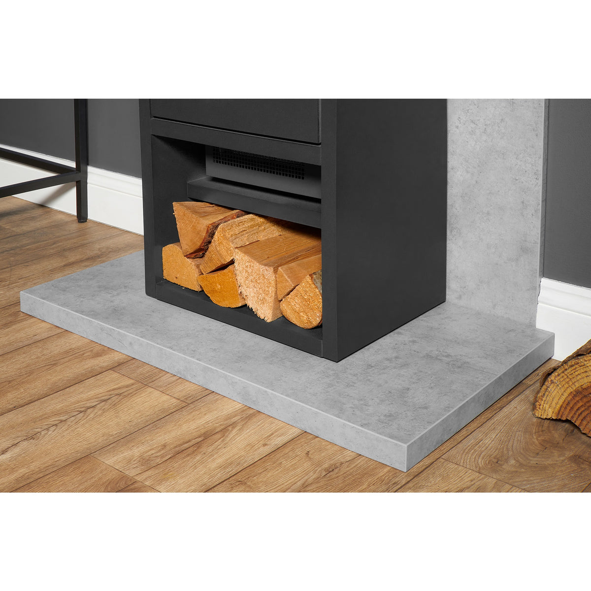 Close up of the log store on the Adam Bergen XL stove on the Acantha concrete effect hearth