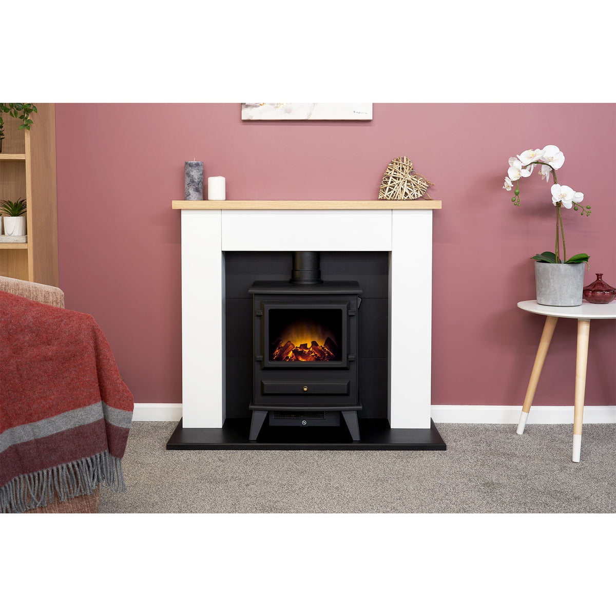 Adam Chester pure white fireplace and black Hudson stove, room setting