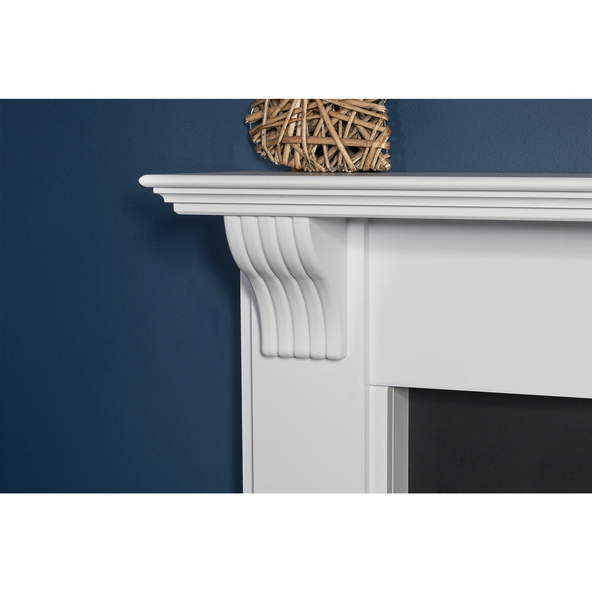 Close-up of the mantel and corbel on the Adam Harrogate pure white fireplace