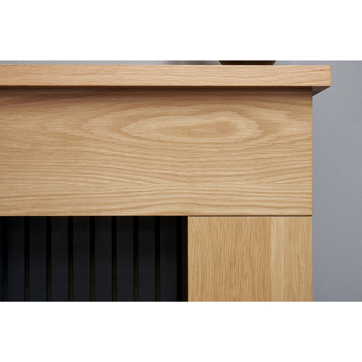 Close-up of the oak finish mantel on the Adam Innsbruck fireplace