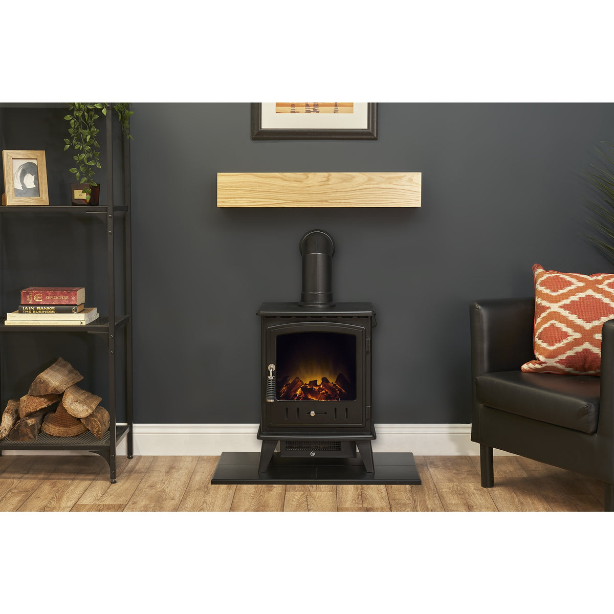 Adam Aviemore electric stove in black on the black hearth below the oak effect beam