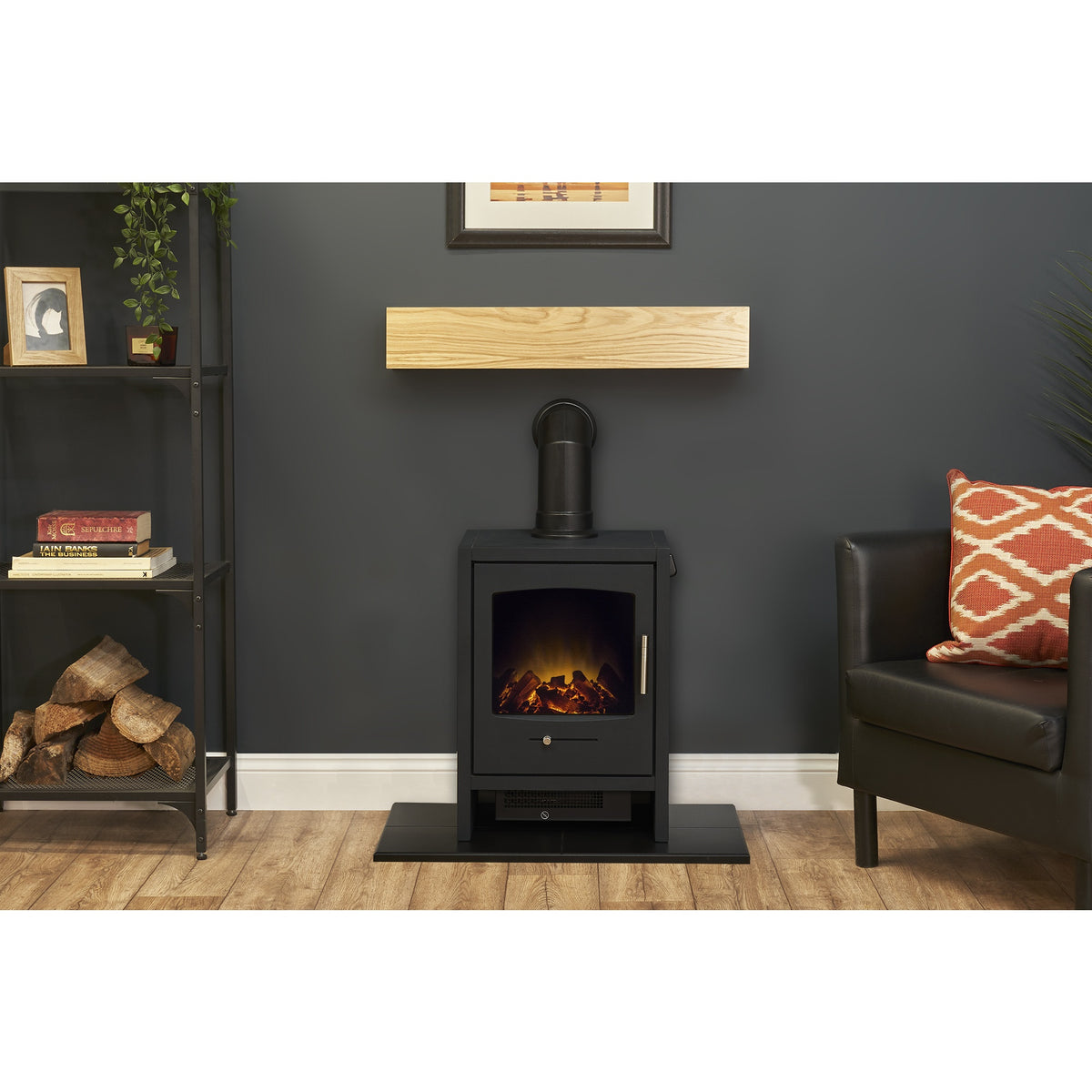 Adam Bergen electric stove in charcoal grey on the black hearth below the oak effect beam