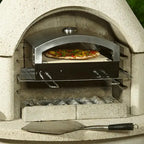 Artisan pizza oven insert baking a pizza inside a Buschbeck masonry barbecue