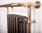 Carron Broughton towel rail in brushed brass with painted cast iron sections, detail