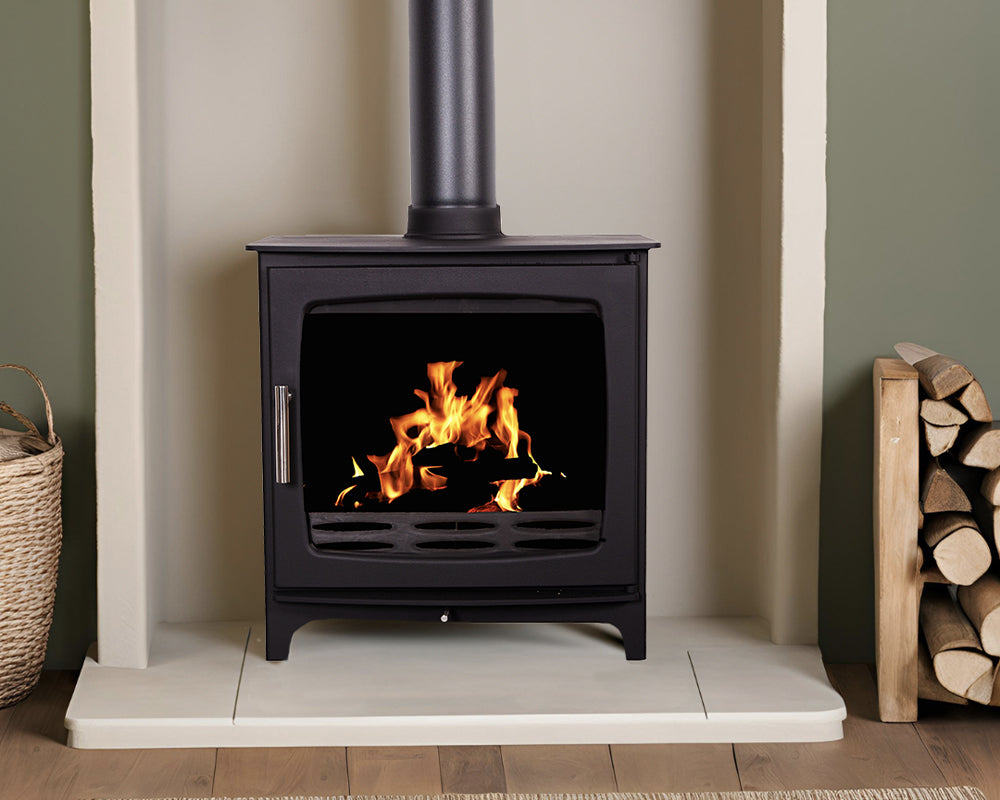 Carron ECO Revolution 8kW wood burning stove in matt black on a hearth