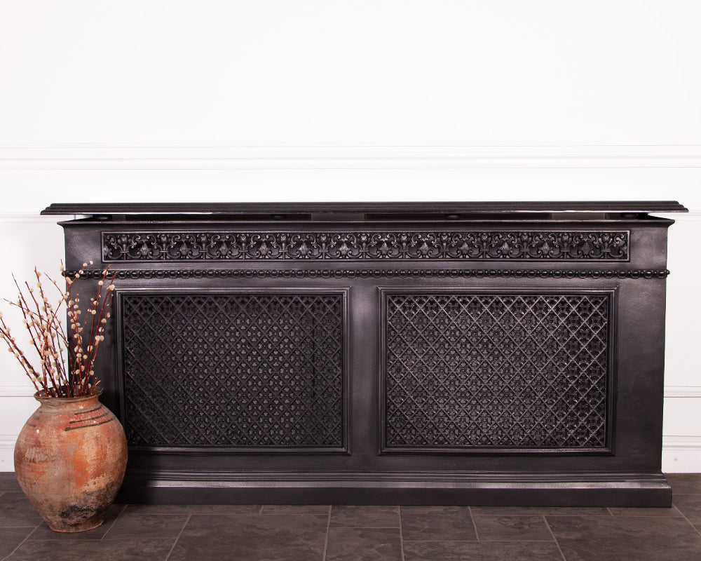 Carron cast iron 2 panel radiator cover in a room setting