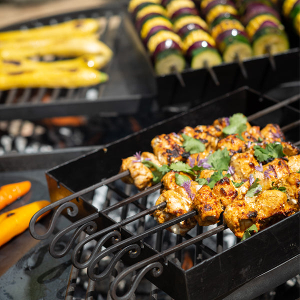 Kebabs cooking on the BBQ King 80 swing arm racks