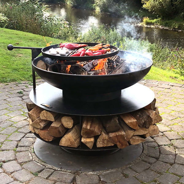 Ring of Logs 90 with its swing arm BBQ rack over the fire