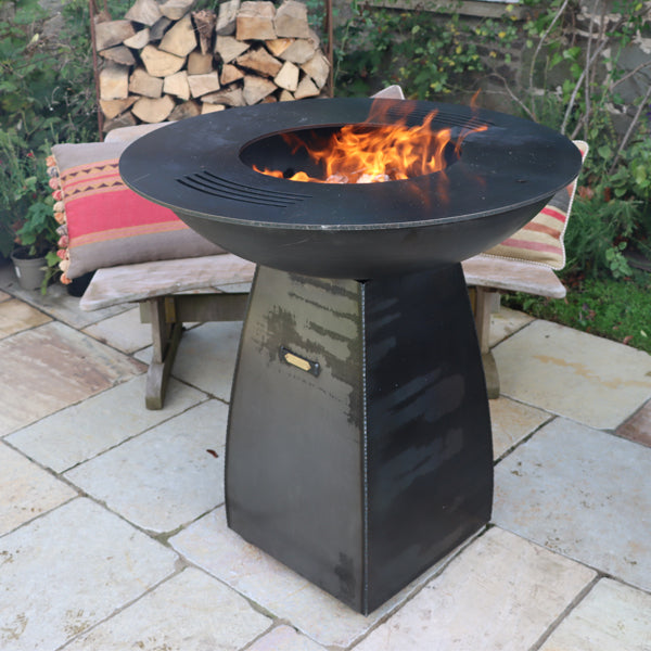 Plancha Fire Pit lit with the grill ring in place