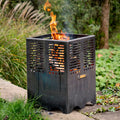 Firepits UK Mini Hex compact steel fire pit lit outdoors