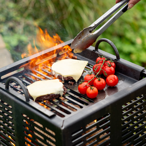 Burgers and tomatoes cooking on the Mini Hex grill