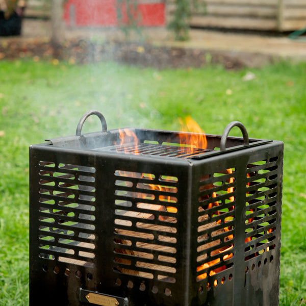 Mini Hex fire pit and grill on a patio