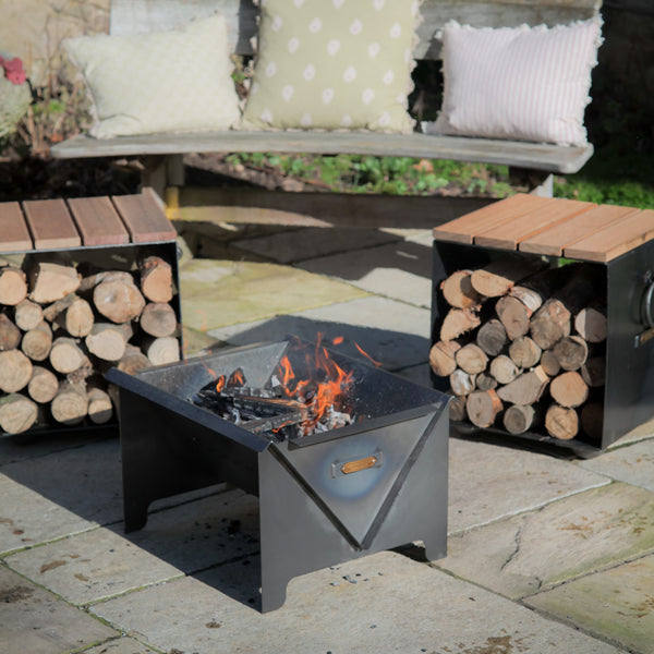 Flat Pack fire pit lit on a patio