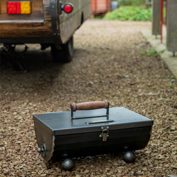 Pitnic BBQ in front of a camper van