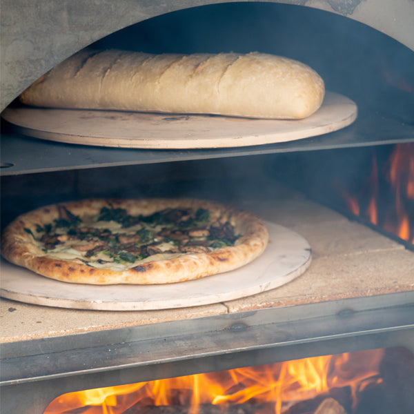Close-up of a pizza inside the Tall Pizza Oven