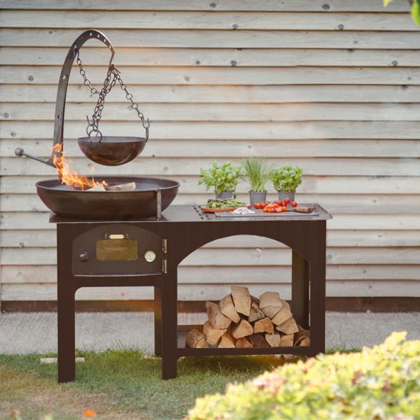 Firepits UK Complete Outdoor Kitchen with fire bowl, work surface and log store in a garden