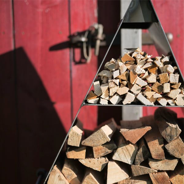 Close-up of logs stacked in the Pyramid log store