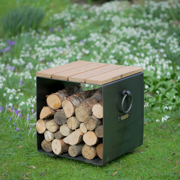 Firepits UK plain log store seat with a hardwood top in a garden