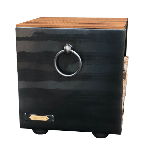 Plain log store seat in steel with a ring handle and slatted hardwood top