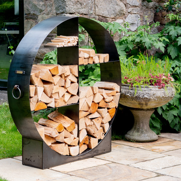 120cm circular log store with logs on a patio