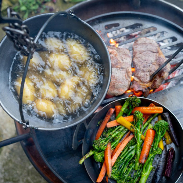Hanging cooking pot over a swing arm rack, seen from above