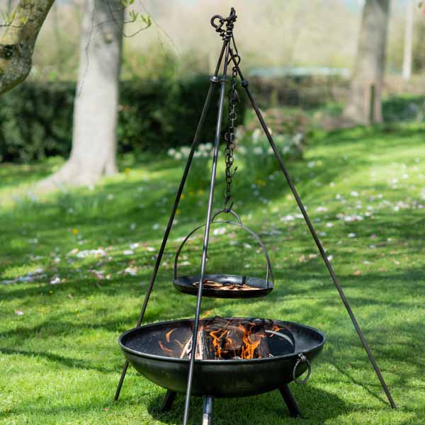 Long Leg tripod standing over a fire pit with a skillet of pancakes