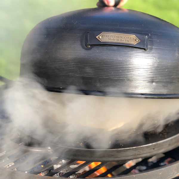 Roasting oven used as a smoker box, with smoke escaping