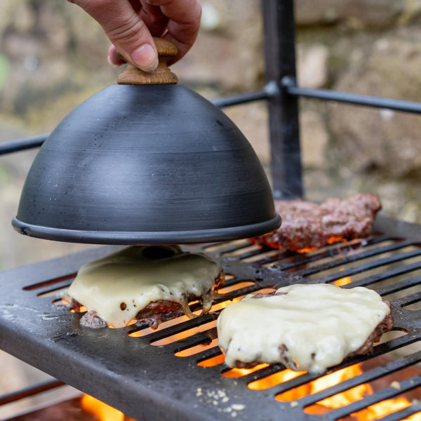 Lifting the burger cloche to reveal a cheeseburger