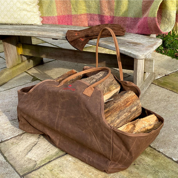 Log carrier bag with logs and fire pit gloves