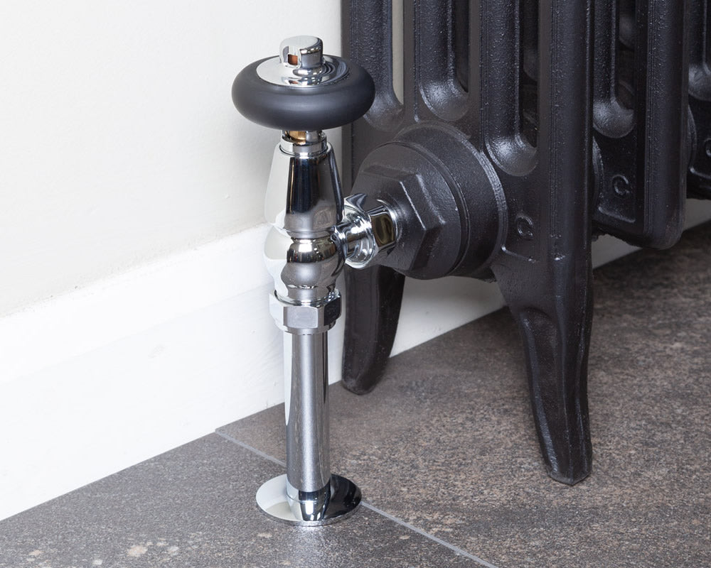 Carron Kingsgrove angled thermostatic valve in chrome installed on a radiator