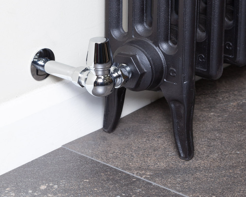 Carron Kingsgrove corner thermostatic valve in chrome installed on a radiator