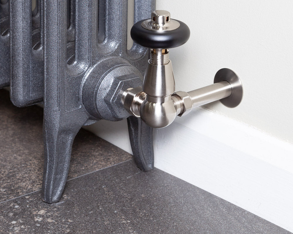 Carron Kingsgrove corner thermostatic valve in satin nickel installed on a radiator